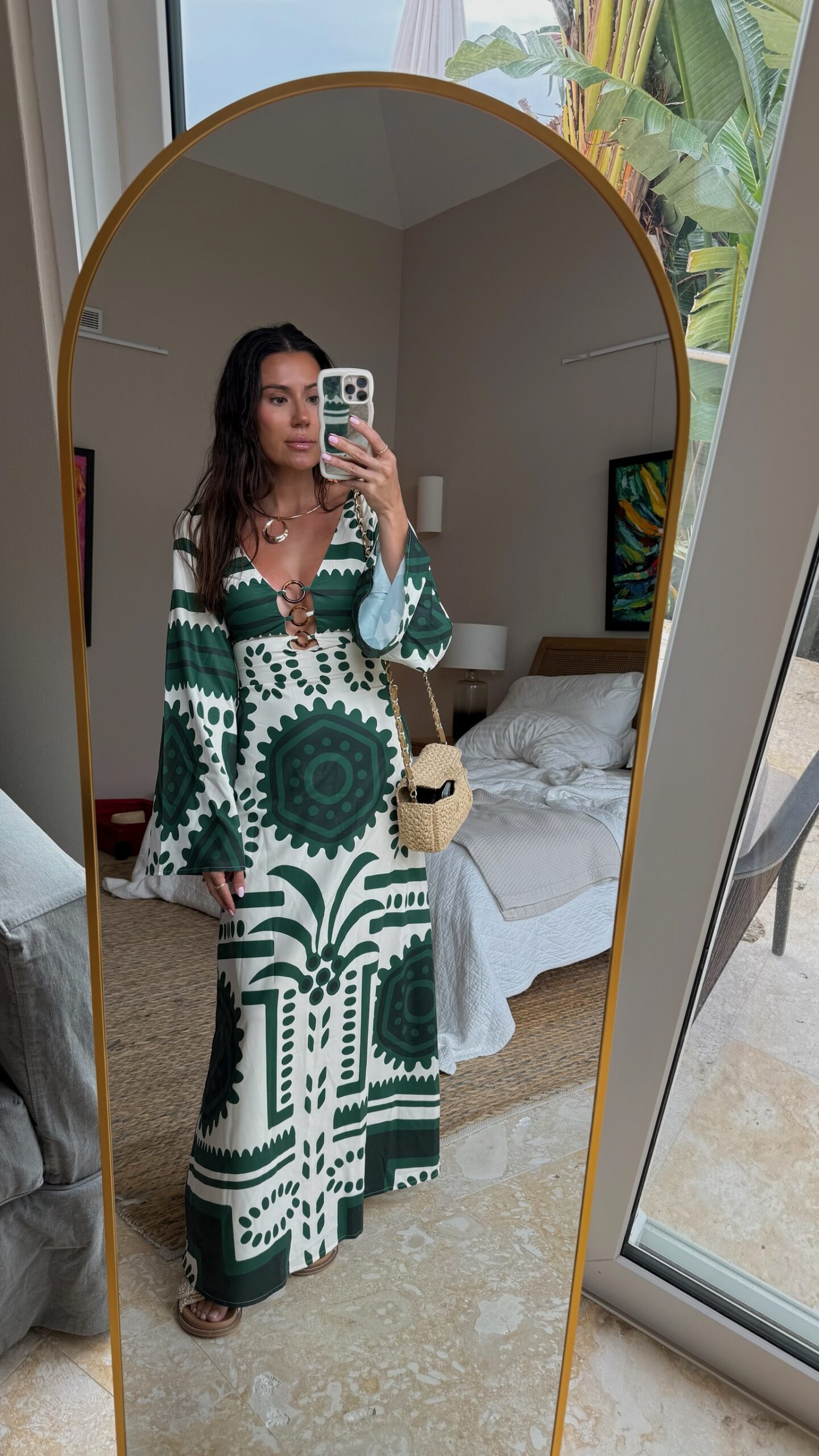 Christine Andrew in a patterned long resort wear beach vacation dress